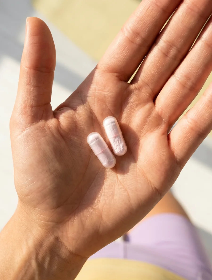 Two Calm+Rest capsules in an open palm