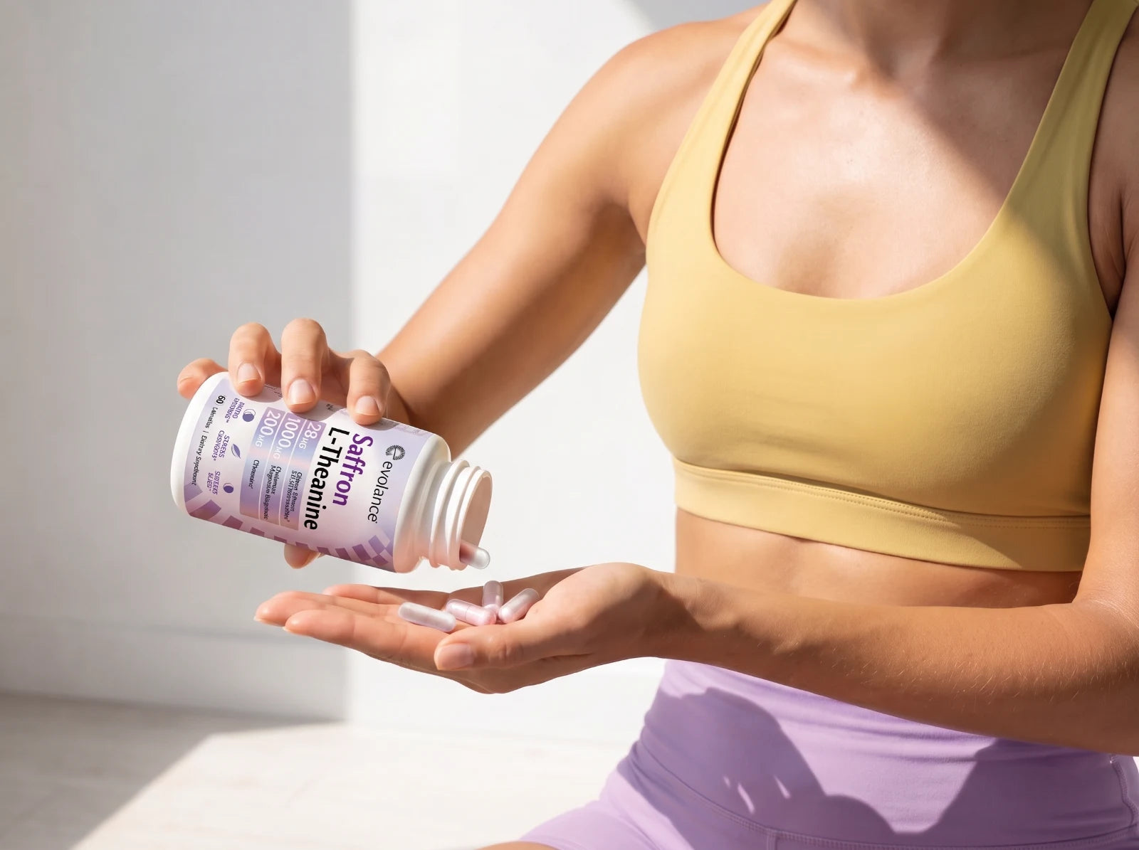 Pouring two Calm+Rest capsules into an open hand